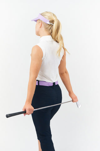 Lilac  stretch webbing Ladies Golf Belt comes with hand enamelled silver buckle with a embossed lady golfer in the belt colour . The belts have a stretch fit for comfort and will compliment or add a splash of colour to your outfit. One Size 8 -16  and 100% Cotton with PU tip.