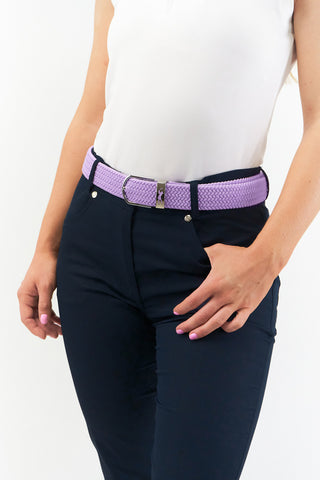 Lilac  stretch webbing Ladies Golf Belt comes with hand enamelled silver buckle with a embossed lady golfer in the belt colour . The belts have a stretch fit for comfort and will compliment or add a splash of colour to your outfit. One Size 8 -16  and 100% Cotton with PU tip.