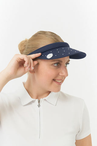 Navy Clip ladies golf visor,  100% polyester with quick-drying fabrics. The visor comes in a one size fits all design which clips around your head to hold it securely in place. It features a concealed magnet in in the strong curved, crystal detailed peak with a hand enameled flower look golf ball marker attached.  The headband features a soft lined absorbent towel.