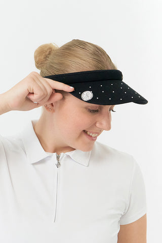 Black Clip ladies golf visor,  100% polyester with quick-drying fabrics. The visor comes in a one size fits all design which clips around your head to hold it securely in place. It features a concealed magnet in in the strong curved, crystal detailed peak with a hand enameled flower look golf ball marker attached.  The headband features a soft lined absorbent towel.