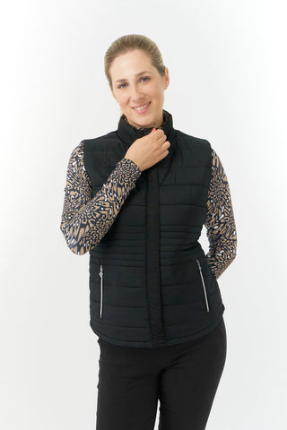 The Pure Golf Eve reversible ladies gilet for golf is insulated, winter-weight, patterned and reversible. It has been Insulated for warmth without being bulky. It has a unique animal print in wild truffle,  on one side and black on the other for versatility of wear. It has pockets on both sides and two-way zippers. The flattering quilting style and fit enhances your silhouette. The colors in this  this piece are Cappuccino,  Champagne and black.  