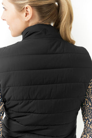 The Pure Golf Eve reversible ladies gilet for golf is insulated, winter-weight, patterned and reversible. It has been Insulated for warmth without being bulky. It has a unique animal print in wild truffle,  on one side and black on the other for versatility of wear. It has pockets on both sides and two-way zippers. The flattering quilting style and fit enhances your silhouette. The colors in this  this piece are Cappuccino,  Champagne and black.  