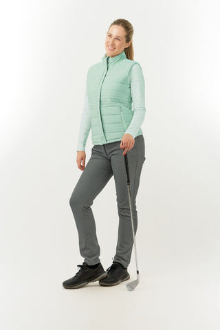 Frosted Sage Pure Golf Eve reversible ladies gilet for golf is insulated, winter-weight, patterned and reversible. It has been Insulated for warmth without being bulky. It has a unique frosted field, floral print  on one side and plain frosted sage on the other for versatility of wear. It has pockets on both sides and two-way zippers. The flattering quilting style and fit enhances your silhouette. 