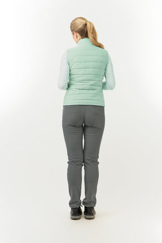 Frosted Sage Pure Golf Eve reversible ladies gilet for golf is insulated, winter-weight, patterned and reversible. It has been Insulated for warmth without being bulky. It has a unique frosted field, floral print  on one side and plain frosted sage on the other for versatility of wear. It has pockets on both sides and two-way zippers. The flattering quilting style and fit enhances your silhouette. 