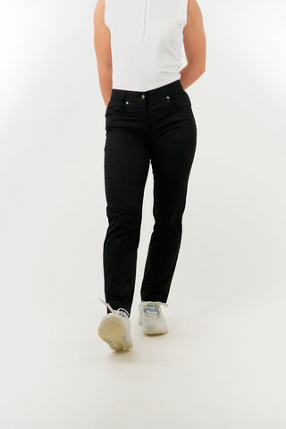 Black ladies golf trousers made from flexible lightweight 4 way stretch material.  Featuring a zip and button fastening with five belt loops, a regular fit with anti-crease and anti-static properties. These women's golf trousers have two open pockets to the front and back. Size 8 to 20.