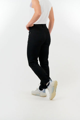 Black ladies golf trousers made from flexible lightweight 4 way stretch material.  Featuring a zip and button fastening with five belt loops, a regular fit with anti-crease and anti-static properties. These women's golf trousers have two open pockets to the front and back. Size 8 to 20.