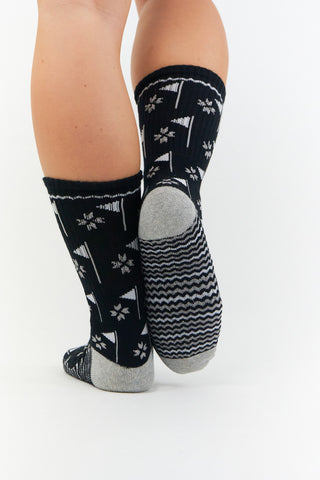 Ladies 3 pair pack in Navy, Grey and Black crew golf socks have a trendy golf flag design with lurex stripe detailing on the sole. Made from a soft, stretchy cotton blend fabric allowing breathability, with a cushioned sole, compression fit and Rib cuff for a snug fit. They are suited to UK sizes between 4 and 7. 85% Cotton, 13% Polyester, 2% Elastane.