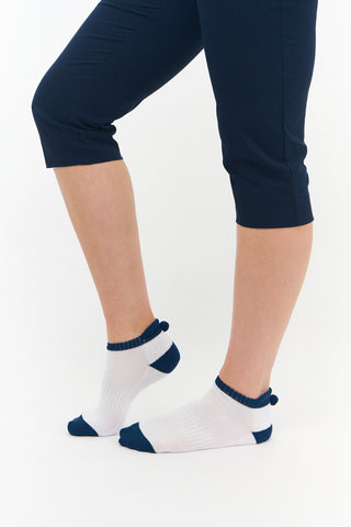 3 pair pack of ankle ladies golf socks, one pair in white with Navy detail on the sole and two pairs in white with Navy heals, toe, cuff and the word golf along the sole. With coordinating colour pom pom on the heel to help the socks hold their position. Made from a soft, stretchy cotton blend fabric allowing breathability, with a cushioned sole and compression fit. They are suited to UK sizes between 4 and 7. 85% Cotton, 13% Polyester, 2% Elastane.