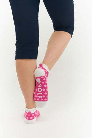 3 pair pack of multi spot in Pink, Blue & Aqua ankle ladies golf socks have a coordinating colour pom pom on the heel to help the socks hold their position. All socks feature the word "golf" on the sole.  Made from a soft, stretchy cotton blend fabric allowing breathability, with a cushioned sole and compression fit. They are suited to UK sizes between 4 and 7. 85% Cotton, 13% Polyester, 2% Elastane.