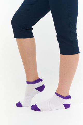 3 pair pack of ankle ladies golf socks In white with coloured heals, toe and cuff in Pink, Blue & Aqua, and matching word golf along the sole. With coordinating colour pom pom on the heel to help the socks hold their position. Made from a soft, stretchy cotton blend fabric allowing breathability, with a cushioned sole and compression fit. They are suited to UK sizes between 4 and 7. 85% Cotton, 13% Polyester, 2% Elastane.