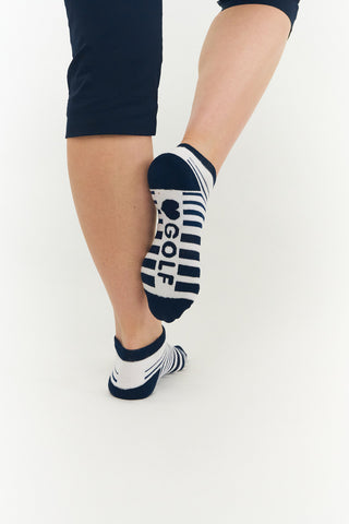 These Navy Ladies Golf Trainer Socks come in a pack of 3 pairs. Designed with a cushioned sole and compression fit, they offer ultimate comfort while their lower ankle cut ensures discreet wear. Two pairs feature an attractive stripe, while one is plain white, all with the word "golf" on the sole. Made from a soft, stretchy cotton blend fabric, these socks are highly breathable and ideal for UK sizes 4-7. Crafted with 85% cotton, 13% polyester, and 2% elastane.