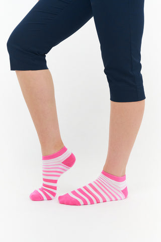 Pink Ladies Golf Trainer Socks come in a 3 pair pack.  The cushioned sole and compression fit provide comfort, while the lower ankle cut makes them less visible when worn. These socks feature an attractive stripe on 2 pairs and 1 white plain design all with the word "golf" on the sole. They are made with a soft, stretchy cotton blend fabric for breathability and are suitable for UK sizes 4-7. Made from 85% cotton, 13% polyester, and 2% elastane.