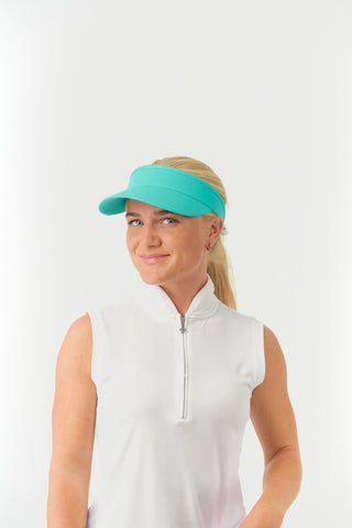 Ocean Blue feminine ladies golf visor constructed with quick-drying fabrics. The visor comes in a one size fits all design with an elasticated cord at the rear to hold it securely in place. It also features a concealed magnet  in peak with a hand enamelled lace golf ball marker attached, making it a lovely golf accessory, golf gift! The headband features a soft lined absorbent towel. 