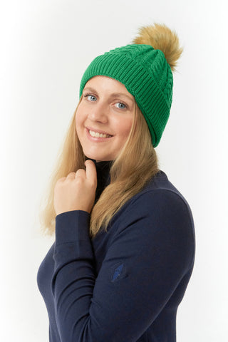 Emerald Green ladies golf hat In an attractive cable knit design. This hat has three layers - an inner waterproof layer plus a soft fleece lining which makes it warm and comfortable. Detachable natural look faux fur bobble.