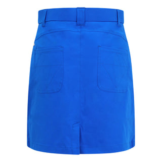 Traditional style lightweight Royal Blue Skort made in a four-way stretch polyester fabric. The skort has a small slit at the back, two front pockets and a zipper with button fastening. The buttons are etched with the Pure Golf logo, which also features on the two back pockets in very subtle stitching for an overall stylish effect. They come with matching attached undershorts.