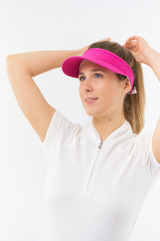 Hot Pink ladies golf visor constructed with quick-drying fabrics. The visor comes in a one size fits all design with an elasticated cord at the rear to hold it securely in place. It also features a concealed magnet  in peak with a hand enamelled lace golf ball marker attached, making it a lovely golf accessory, golf gift! The headband features a soft lined absorbent towel. 