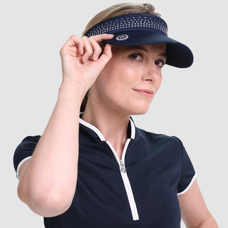 Navy telephone wire crystal ladies golf visor constructed with quick-drying fabrics. The visor comes in a one size fits all. It also features a concealed magnet  in the strong curved peak with a hand enameled lace effect flower shaped golf ball marker. The headband features a soft lined absorbent towel and is crystal-adorned. 